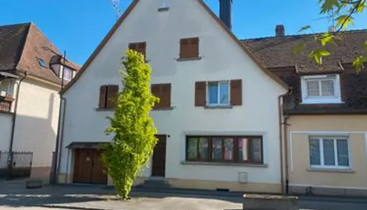 Maison à fort potentielle avec jardin, cave, et garage double 