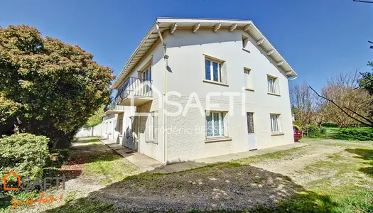 Maison T9 270m² avec garage, dépendance et parc arboré.