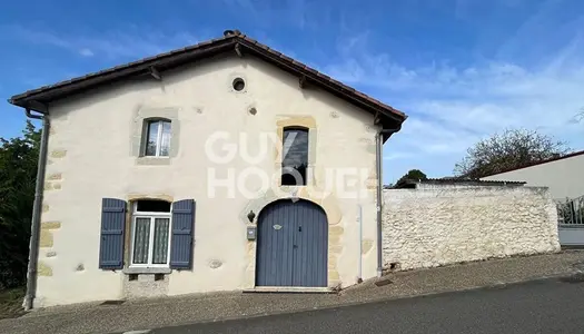 Maison avec possibilité d'agrandissement et jardin 