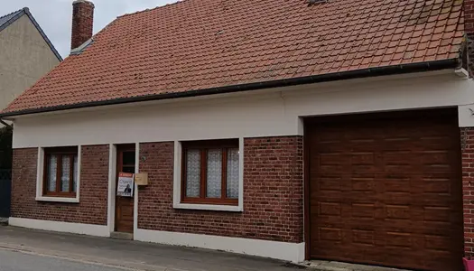 Maison au fort potentiel avec jardin et garages