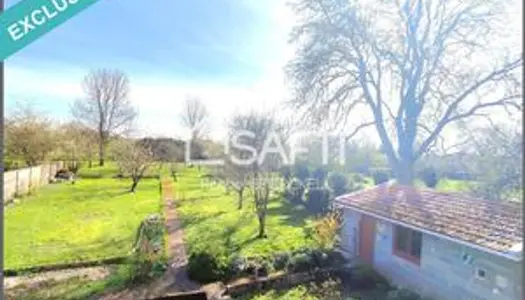 Maison individuelle en pierres de taille avec garage, dépendance, combles aménageables et jardin